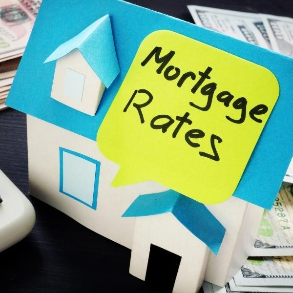 Mortgage rates sticker on blue house