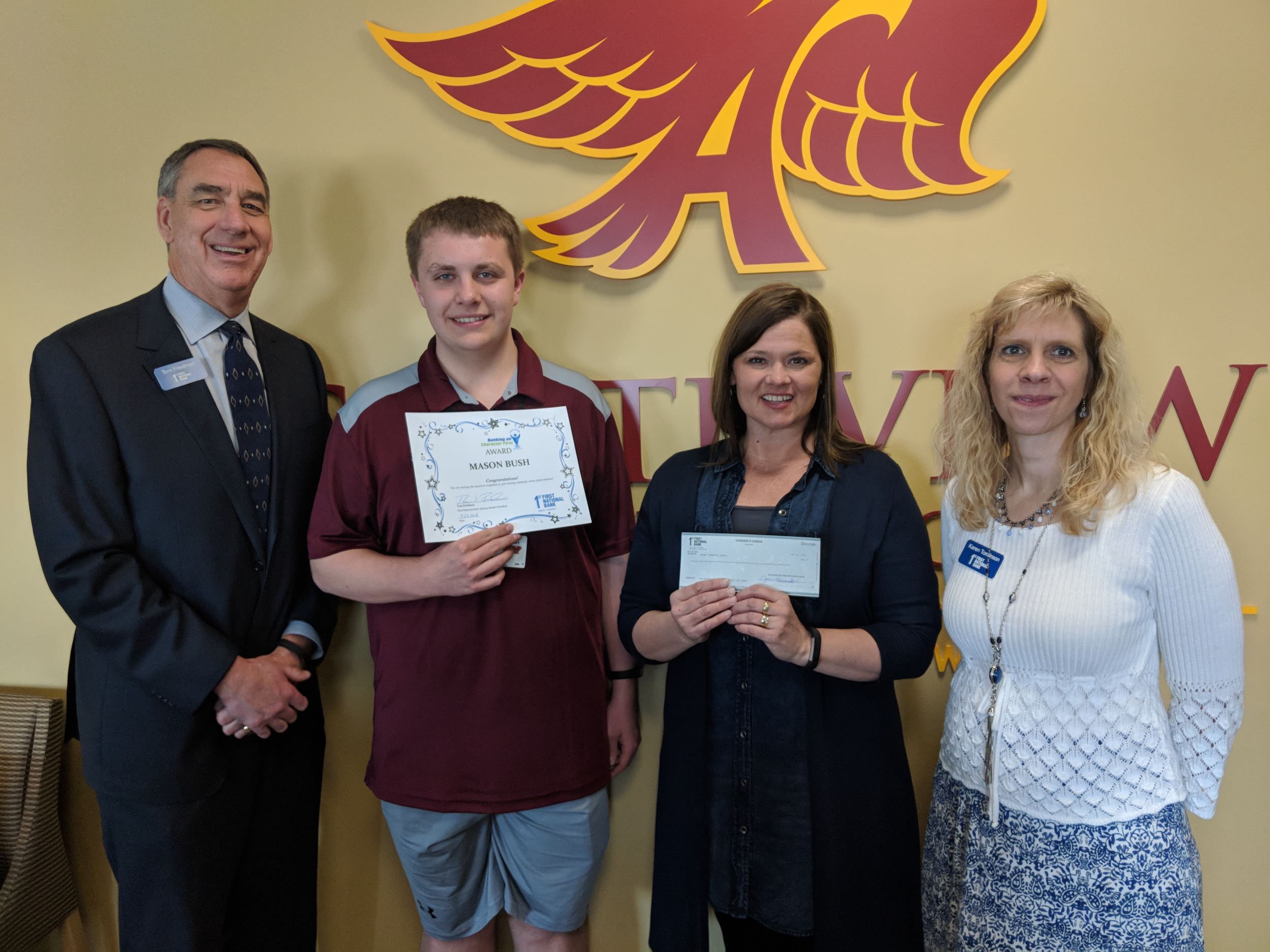 Pictured from left to right, Tom Friedman - Market President First National Bank Ankeny, Mason Bush 